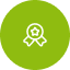 Green circle icon featuring a white award ribbon with a checkmark, symbolizing certification or achievement.
