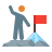 Person climbing a blue mountain peak and reaching toward a red flag at the summit.